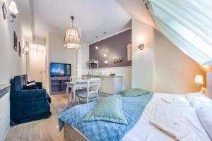 Posteľ alebo postele v izbe v ubytovaní Apartamenty Kurort