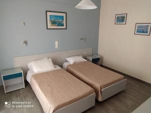 Postel nebo postele na pokoji v ubytování Moros Apartments