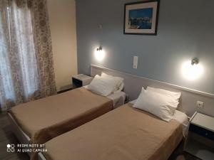 Postel nebo postele na pokoji v ubytování Moros Apartments
