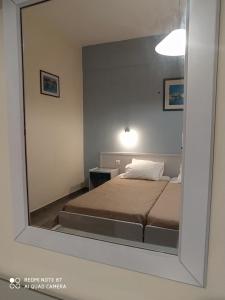 Postel nebo postele na pokoji v ubytování Moros Apartments