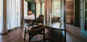 Area soggiorno di Floris Green Suites by Parc Hotel Florian