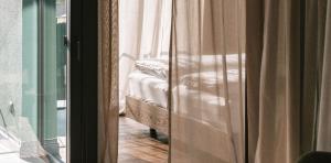 Letto o letti in una camera di Floris Green Suites by Parc Hotel Florian