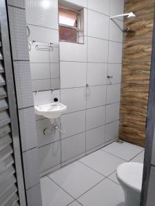 a bathroom with a sink and a toilet at HOTEL CIDADE EXPRESS 24H in Teresina