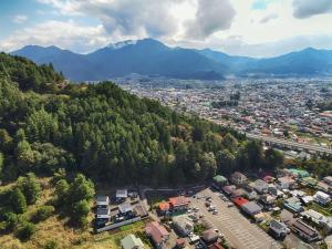 an aerial view of a city with a mountain at Villas Asama no Iori in Fujiyoshida