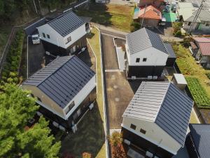 an overhead view of a row of houses with roofs at Villas Asama no Iori in Fujiyoshida