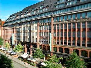 a large building with a lot of windows at Apartment Residences at Park Hyatt Hamburg in Hamburg