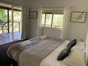 
a bedroom with a bed and a window at Yanada in St. Albans
