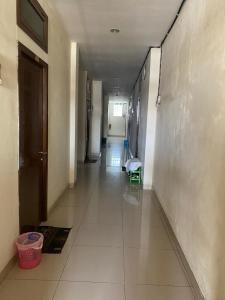 a hallway of a building with a long corridor at Villa Yasmin Malino in Malino