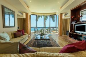 a living room with a couch and a table at Villa Albella in San Agustin