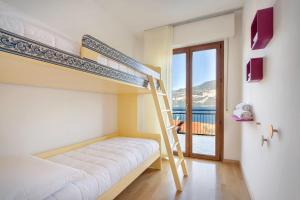 Posteľ alebo postele v izbe v ubytovaní Villa Mimosa-Con piscina e vista lago