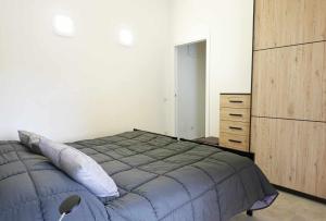 מיטה או מיטות בחדר ב-Casa Valeria intero appartamento