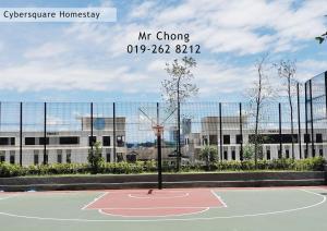a basketball court in front of a building at Cybersqaure Studio Suites with Netfilx @10 min walking distance to McD in Cyberjaya