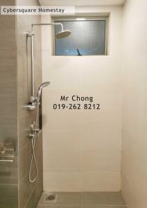 a bathroom with a shower with a window at Cybersqaure Studio Suites with Netfilx @10 min walking distance to McD in Cyberjaya