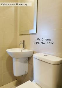 a bathroom with a white toilet and a sink at Cybersqaure Studio Suites with Netfilx @10 min walking distance to McD in Cyberjaya