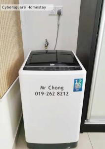 a mr chopping machine sitting in a room at Cybersqaure Studio Suites with Netfilx @10 min walking distance to McD in Cyberjaya
