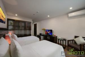 TV a/nebo společenská místnost v ubytování Azure Sapa Hotel