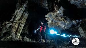 a man standing in a cave with lights at RIVERVIEW HOMESTAY PERLIS in Kangar