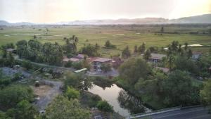 an aerial view of a house with a river at RIVERVIEW HOMESTAY PERLIS in Kangar