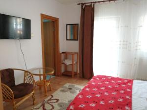 TV a/nebo společenská místnost v ubytování Casa Zura