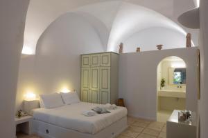 Ένα ή περισσότερα κρεβάτια σε δωμάτιο στο Aria Lito Mansion 