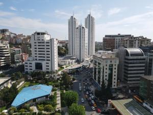 a city street with tall buildings and tall buildings at Vital Hotel Fulya Istanbul Sisli in Istanbul