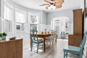 a dining room with a table and chairs at Large Beach Home with Ocean Views from Balcony Unit 2 and 3 in Ventnor City