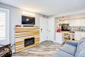 a living room with a couch and a fireplace at Luxury Studio Getaway at Blue Mountains 80114 in Blue Mountains