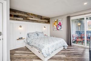 a bedroom with a bed with a wooden wall at Luxury Studio Getaway at Blue Mountains 80114 in Blue Mountains +25 photos