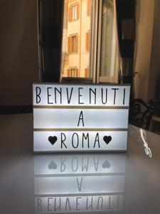 a set of stairs with the words farewell a roma bowlyn at Casa Giorgia luxury apartment in Rome