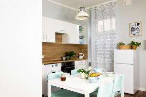 Kuchyňa alebo kuchynka v ubytovaní Apartamenty KDN na Rysiej