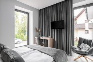 Televízia a/alebo spoločenská miestnosť v ubytovaní Villa 33