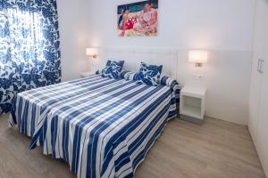 Cama o camas de una habitación en Hotel Tahití Playa