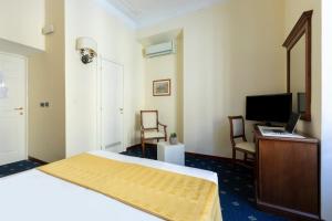 Postel nebo postele na pokoji v ubytování Hotel Coppede'