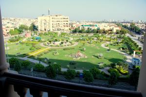a view of a park from a window at Executive 3 Bedrooms Apartment In Bahria Town in Rawalpindi