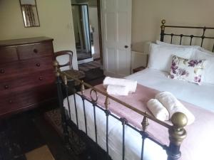 a bedroom with a bed with towels on it at Low House Farm North, Troutbeck, Windermere in Windermere