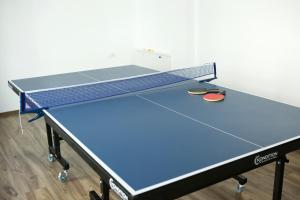 a ping pong table in a room with at Pensiunea Prisaca Dornei in Prisaca Dornei