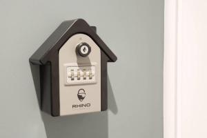a plug in bird house hanging on a wall at BlackBird Luxury Accommodation Room 6 in Blackpool