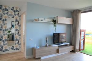 TV a/nebo společenská místnost v ubytování El Alisio Beach