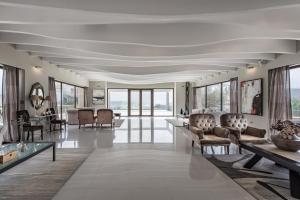 a living room with chairs and a table at GARDELLI RESORT in Laganas