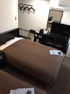 Cama o camas de una habitación en Plaza Hotel Fujinoi