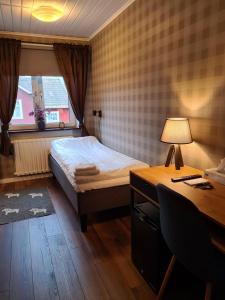 Säng eller sängar i ett rum på Dala-Järna Hotell och Vandrarhem