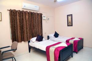 Voodi või voodid majutusasutuse DAFFODILS SERVICED APARTMENT toas