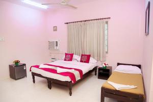 Voodi või voodid majutusasutuse DAFFODILS SERVICED APARTMENT toas