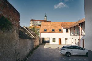 a car parked in a parking lot next to a building at Apartmán NEWSTALGIE in Mikulov