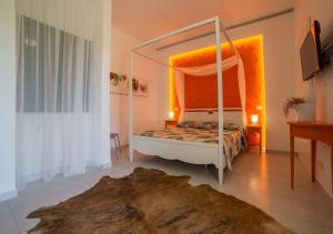 a bedroom with a bed with a canopy at Centro Vacanze Poker in Casalbordino +51 photos
