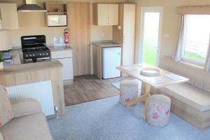 
A kitchen or kitchenette at Holiday Home at Newquay Bay Resort
