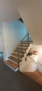 a staircase in a house with a glass railing at Villa Silberberg in Winterberg