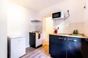 Een keuken of kitchenette bij Appartement design Coty 4 pers Centre ville Le Havre