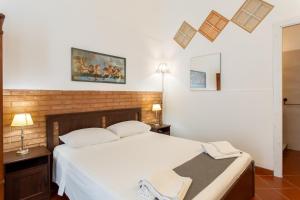 A bed or beds in a room at Le Dimore del Mito - Atalanta