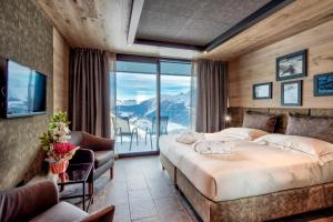 Postel nebo postele na pokoji v ubytování Re Delle Alpi Resort & Spa, 4 Stelle Superior